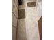 Bathroom floor features decorative tiling and neutral colored rugs at 1046 Sans Souci Way, Clarkston, GA 30021