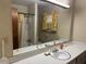 Bathroom features a large mirror, a single sink, and a shower-tub combo at 1046 Sans Souci Way, Clarkston, GA 30021