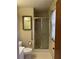 Bathroom features a glass-enclosed shower, grab bars, and a window with curtains at 1046 Sans Souci Way, Clarkston, GA 30021