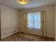 Bedroom featuring large windows, carpeted floors at 1046 Sans Souci Way, Clarkston, GA 30021
