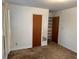 Bedroom featuring a closet and carpeted floors at 1046 Sans Souci Way, Clarkston, GA 30021