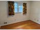 Bright bedroom with hardwood floors, natural light, and radiator at 1046 Sans Souci Way, Clarkston, GA 30021