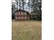 Charming two-story brick home with traditional architecture and a well-maintained front lawn at 1046 Sans Souci Way, Clarkston, GA 30021
