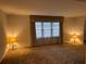 Inviting living room with ample natural light from a central window at 1046 Sans Souci Way, Clarkston, GA 30021