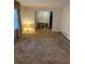 Bright living room featuring neutral walls, a large window, and carpeted floor at 1046 Sans Souci Way, Clarkston, GA 30021