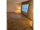 Spacious living room offering plenty of natural light and carpeted flooring at 1046 Sans Souci Way, Clarkston, GA 30021