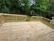 Wood deck features railings and stairs leading to the backyard with an overview of the surrounding greenery at 2346 Pryor Sw Rd, Atlanta, GA 30315