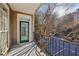 Balcony with black metal railing, and an view of the trees and the parking lot at 4203 Stratford Commons # 4203, Decatur, GA 30033