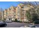 Apartment building featuring balconies and manicured landscaping at 4203 Stratford Commons # 4203, Decatur, GA 30033