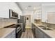 Modern kitchen featuring stainless steel appliances, stone countertops, and gray shaker cabinets at 4203 Stratford Commons # 4203, Decatur, GA 30033