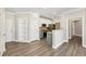 Open-concept living room and kitchen, with stainless steel appliances, and bright natural light at 4203 Stratford Commons # 4203, Decatur, GA 30033