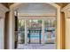 A picturesque pool view from under the covered area, with a gate for security and trees in the background at 4203 Stratford Commons # 4203, Decatur, GA 30033