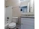 Bathroom with a white vanity, granite countertop, and shower-tub combination at 645 Plainville Sw Dr, Atlanta, GA 30331
