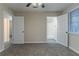 Bedroom featuring gray carpet and multiple doors for easy access at 645 Plainville Sw Dr, Atlanta, GA 30331