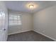 A carpeted bedroom offers a bright, airy feel at 645 Plainville Sw Dr, Atlanta, GA 30331