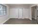 Spacious bedroom features wood-look flooring and three closets at 645 Plainville Sw Dr, Atlanta, GA 30331