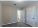 A carpeted bedroom offers views of a connected bathroom at 645 Plainville Sw Dr, Atlanta, GA 30331