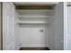 Open closet showcasing ample storage space with multiple shelves and hanging areas at 645 Plainville Sw Dr, Atlanta, GA 30331