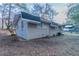 Exterior view of the home highlighting the side yard, brick, and architectural details at 645 Plainville Sw Dr, Atlanta, GA 30331