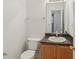 Bathroom featuring a wood vanity and a sink with a mirror at 780 Edenberry Ln, Lithonia, GA 30058