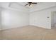 Bedroom featuring neutral tones, carpet, ceiling fan, and large closet at 780 Edenberry Ln, Lithonia, GA 30058