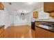 Modern kitchen with wood cabinets, stainless steel appliances, and hardwood floors at 780 Edenberry Ln, Lithonia, GA 30058