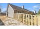 A view of the home's backyard, featuring a newly installed wooden fence, offering privacy and security at 1176 Whatley Mill Ln, Lawrenceville, GA 30045