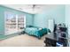 Bedroom featuring blue walls, carpet, ceiling fan and natural light at 1176 Whatley Mill Ln, Lawrenceville, GA 30045