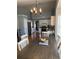 Dining room featuring a wood table, white walls, and stainless steel appliances at 1176 Whatley Mill Ln, Lawrenceville, GA 30045