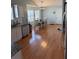 Bright dining room featuring wood floors, white walls, and a wooden dining table with six chairs at 1176 Whatley Mill Ln, Lawrenceville, GA 30045