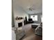 Cozy living room featuring carpet flooring, vaulted ceilings, and a fireplace with decorations at 1176 Whatley Mill Ln, Lawrenceville, GA 30045