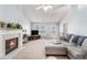 Bright living room features a fireplace, neutral furniture, and a vaulted ceiling at 1176 Whatley Mill Ln, Lawrenceville, GA 30045