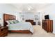 Large main bedroom with wood furniture set, windows, and vaulted ceiling at 1176 Whatley Mill Ln, Lawrenceville, GA 30045