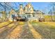 Expansive backyard view, showcasing a deck, lush lawn and the home's rear elevation at 2685 Lenora Church Rd, Snellville, GA 30078