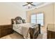 Well-appointed bedroom boasts a ceiling fan, tray ceiling, and natural light at 2685 Lenora Church Rd, Snellville, GA 30078