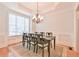 Elegant dining room with large window, chandelier, and formal decor at 2685 Lenora Church Rd, Snellville, GA 30078