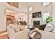 Bright open-concept living room seamlessly connecting to the kitchen and dining area at 2685 Lenora Church Rd, Snellville, GA 30078