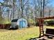 Backyard featuring a shed and bench at 310 Creekside Trl, Covington, GA 30016