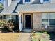 Cozy entryway featuring a brick facade, well-lit porch, and a welcoming front door at 310 Creekside Trl, Covington, GA 30016