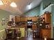 This kitchen features wood cabinets, modern appliances, and ample counter space, creating a functional cooking area at 310 Creekside Trl, Covington, GA 30016