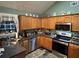 Bright kitchen featuring modern appliances, ample counter space, and a stylish backsplash at 310 Creekside Trl, Covington, GA 30016