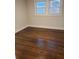 Bedroom with two windows and beautiful hardwood floors at 3112 Cloverhurst Dr, Atlanta, GA 30344