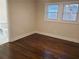 Bedroom with hardwood floors and two windows providing natural light at 3112 Cloverhurst Dr, Atlanta, GA 30344