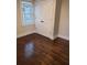 Bedroom with hardwood floors, a window, and a closet at 3112 Cloverhurst Dr, Atlanta, GA 30344