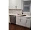 Updated kitchen with stainless steel dishwasher and white cabinets at 3112 Cloverhurst Dr, Atlanta, GA 30344