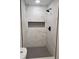 Contemporary shower with gray mosaic floor tile and large marble look wall tiles at 3112 Cloverhurst Dr, Atlanta, GA 30344