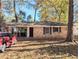 Charming brick home featuring a convenient carport, enhancing curb appeal and providing sheltered parking at 1692 Shirley Sw St, Atlanta, GA 30310