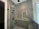 Sleek bathroom with a glass-enclosed shower, rainfall shower head, and modern tile work at 222 Blossom Trl, Acworth, GA 30101