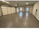 Spacious three car garage with finished floor and an electric vehicle charging outlet at 222 Blossom Trl, Acworth, GA 30101