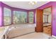 Unique purple bathroom with a large tub, bay window, and tiled floor at 2541 Deer Isle Cv, Lawrenceville, GA 30044